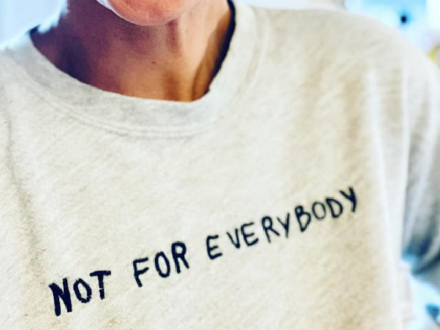 Friend wears grey sweatshirt that says not for everybody