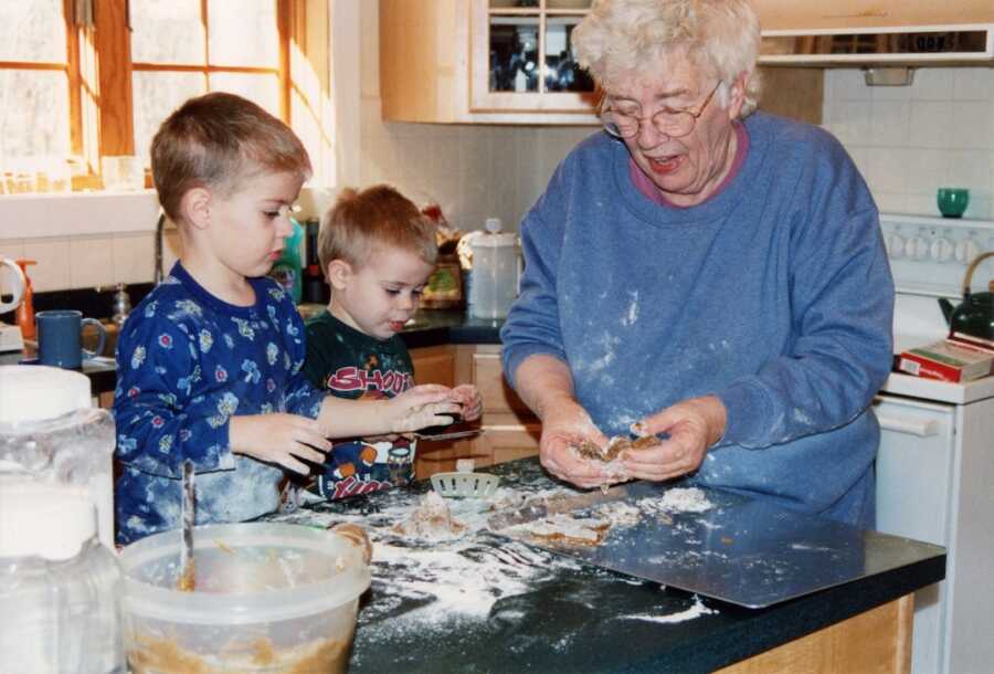grandma in the kitchen with two grandsons baking