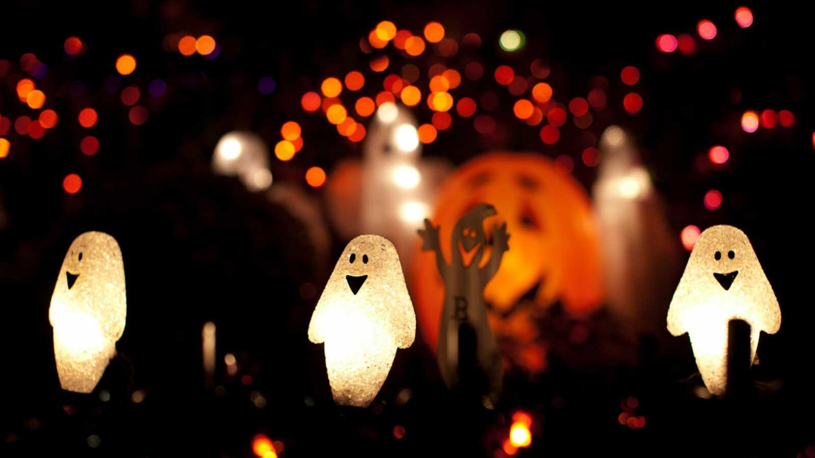 Halloween lawn decorations and lights at night