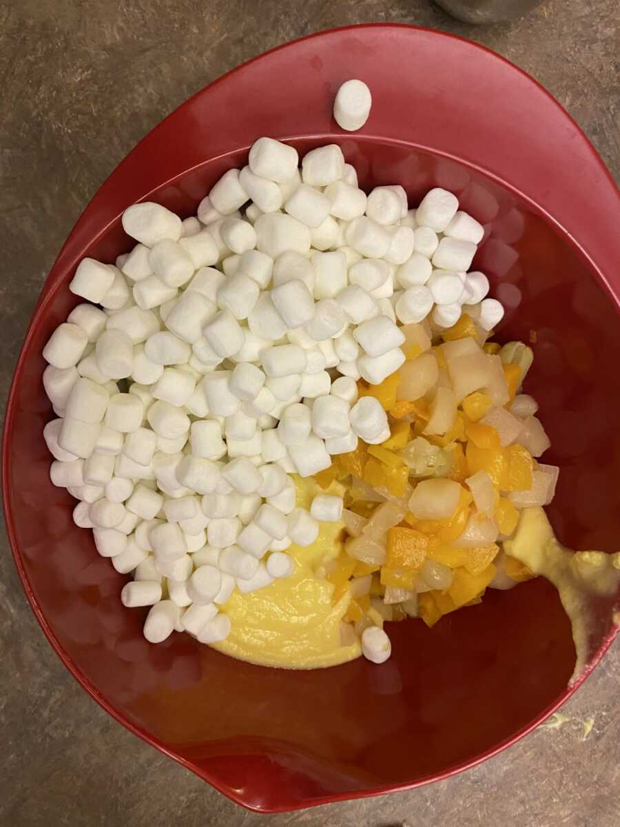 fruit, marshmallows, and custard in bowl