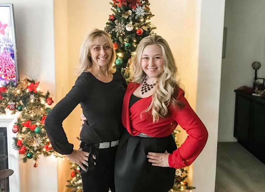 daughter standing with her mom on Christmas