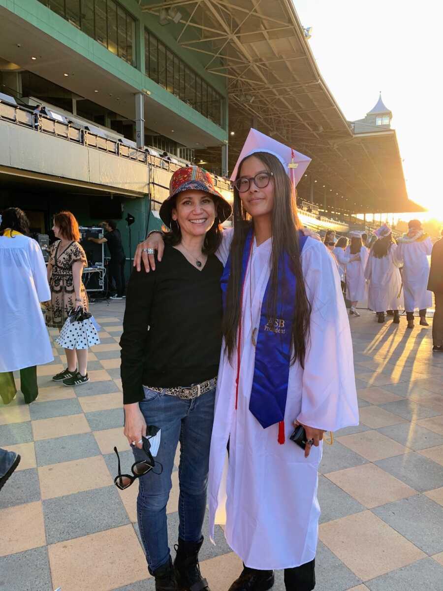 mother and adopted daughter at high school graduation