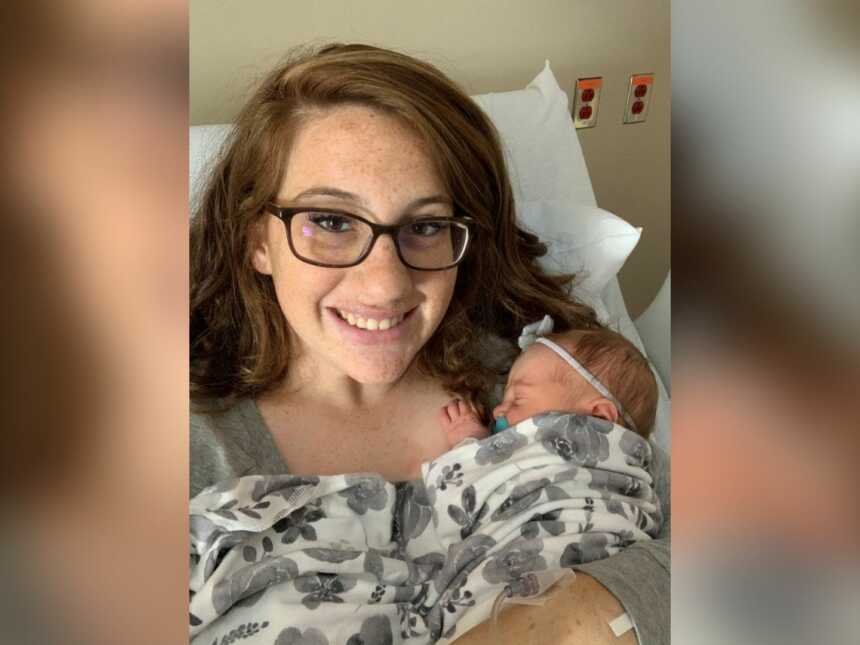 Mother holding new born baby after giving birth