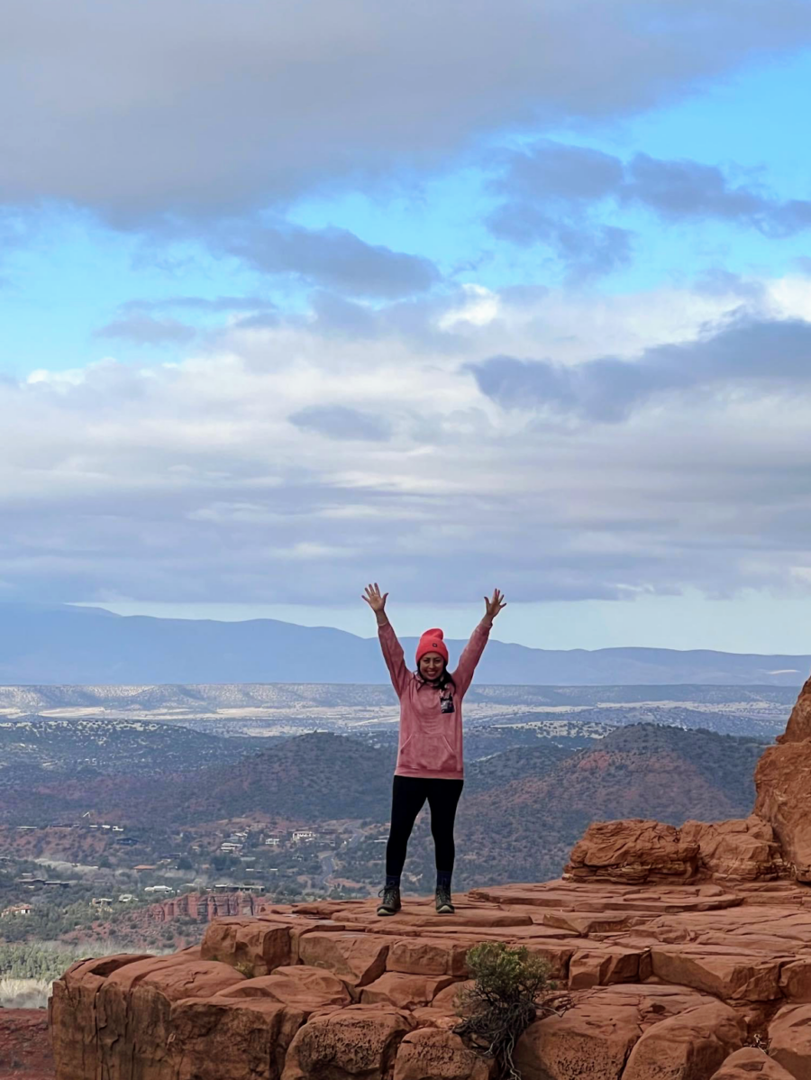 recovered alcoholic standing on red rocks overlooking canyon