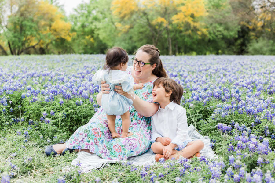 single foster mom with adopted son holding foster placement