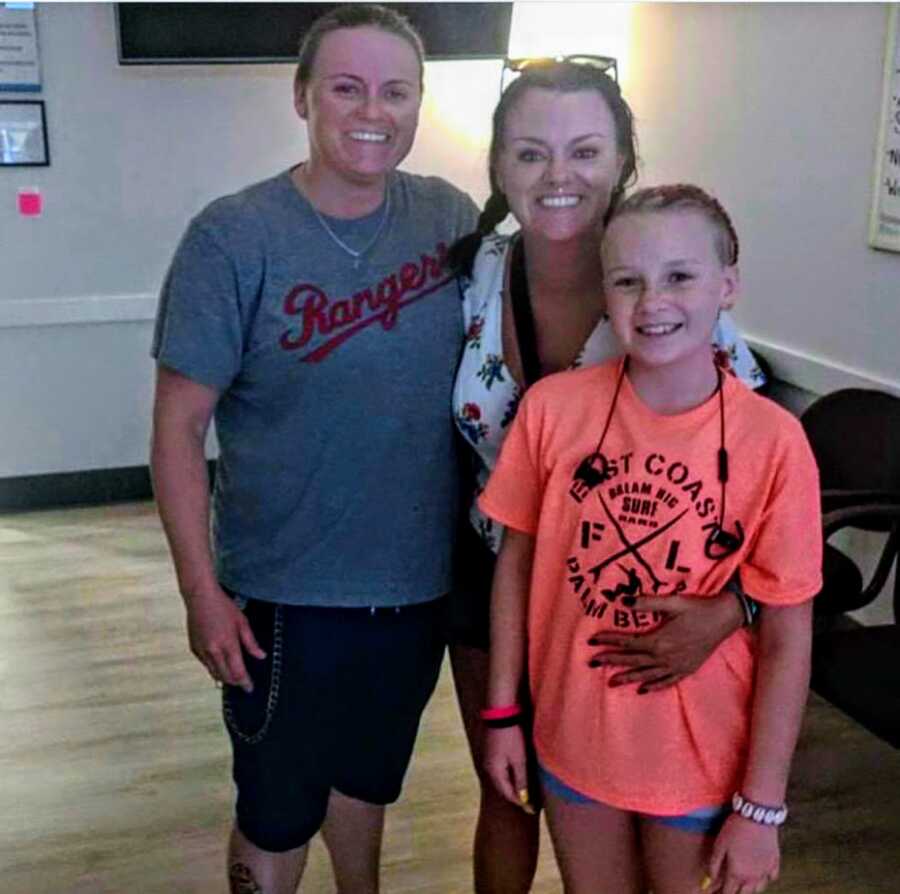 sober mom standing with sister and daughter