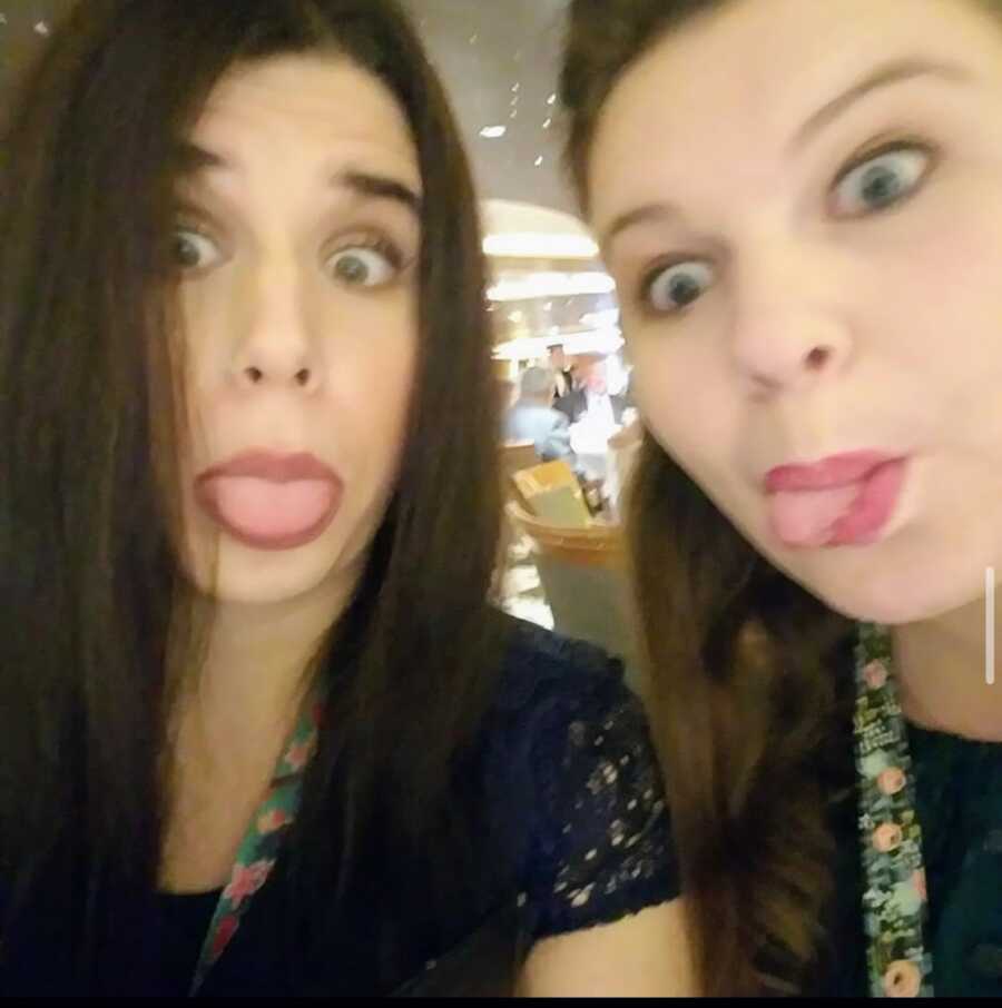 girl having seizures with a friend sticking their tongues out