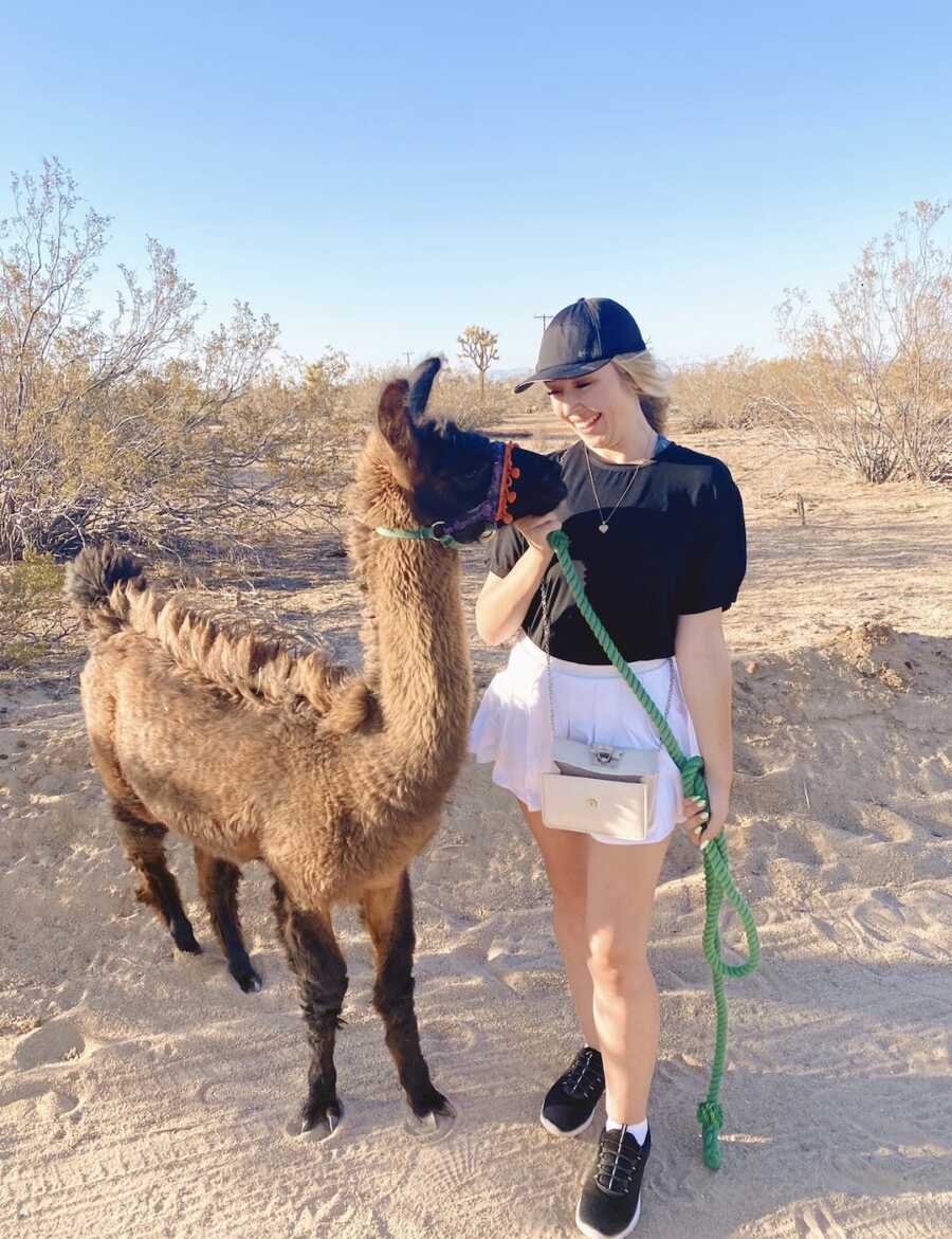 woman walking an Llama