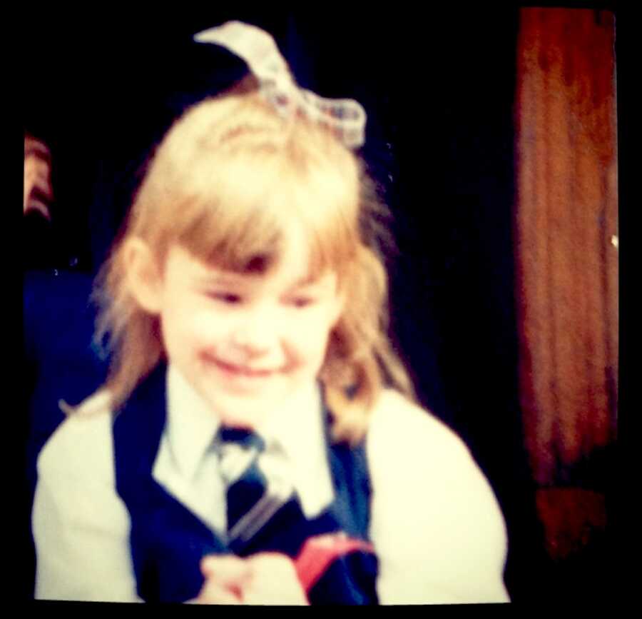 young girl dressed up in her school uniform