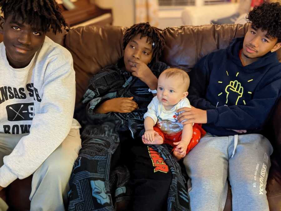 siblings sitting together on the couch