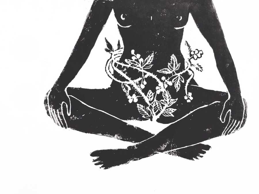 artwork of woman sitting criss cross with vines around her pelvic area