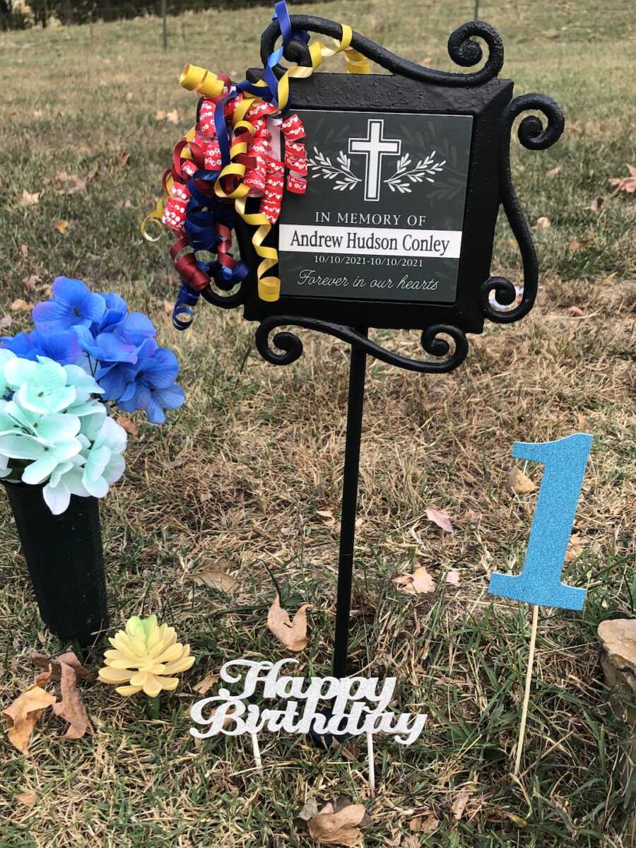 decorations on child's grave to celebrate his first birthday