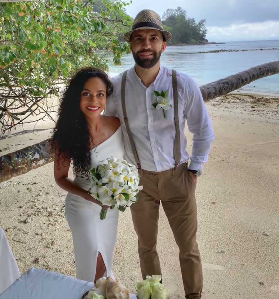 couple dressed up and posing together on their wedding day