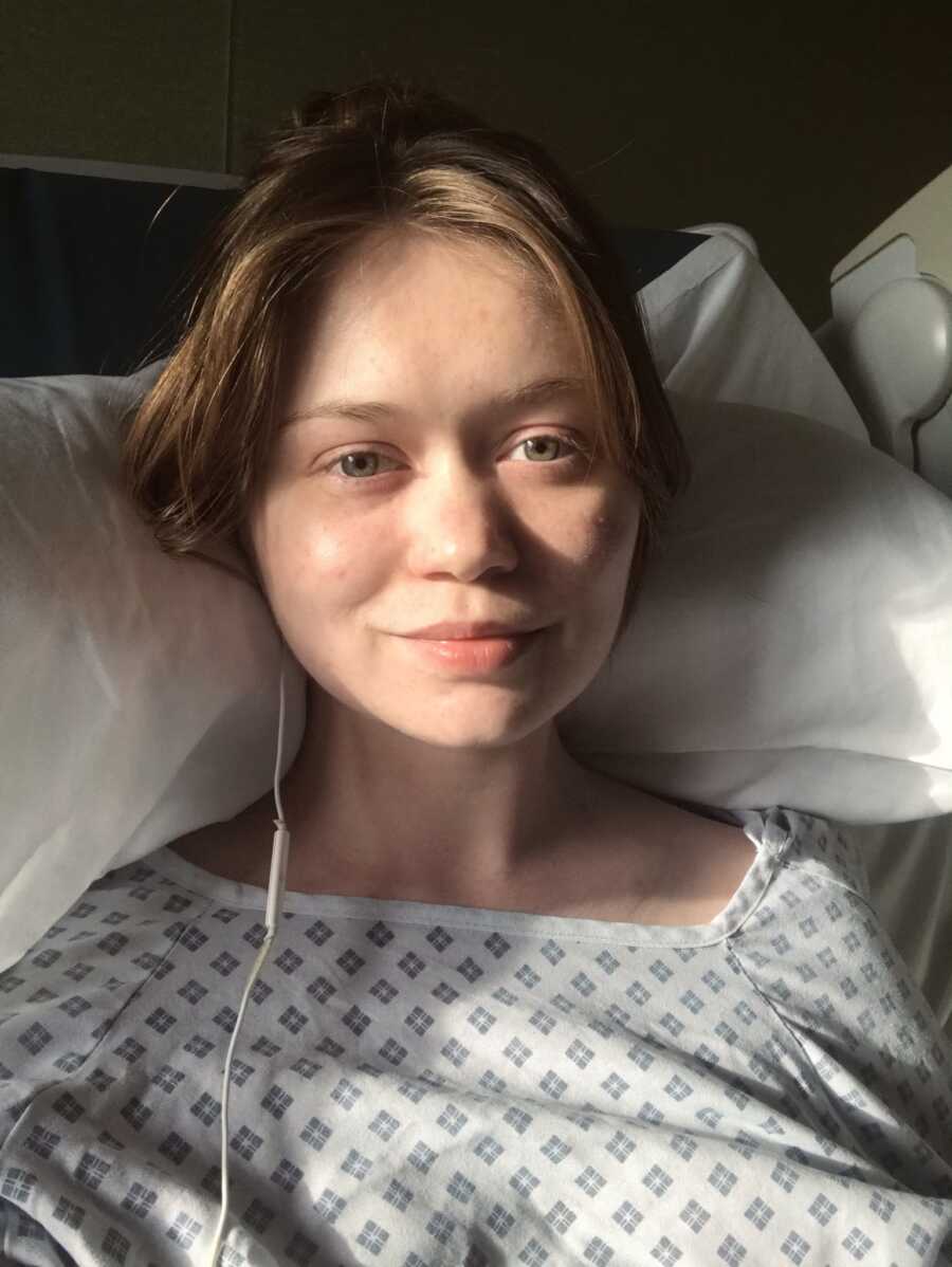selfie of woman with endometriosis softly smiling