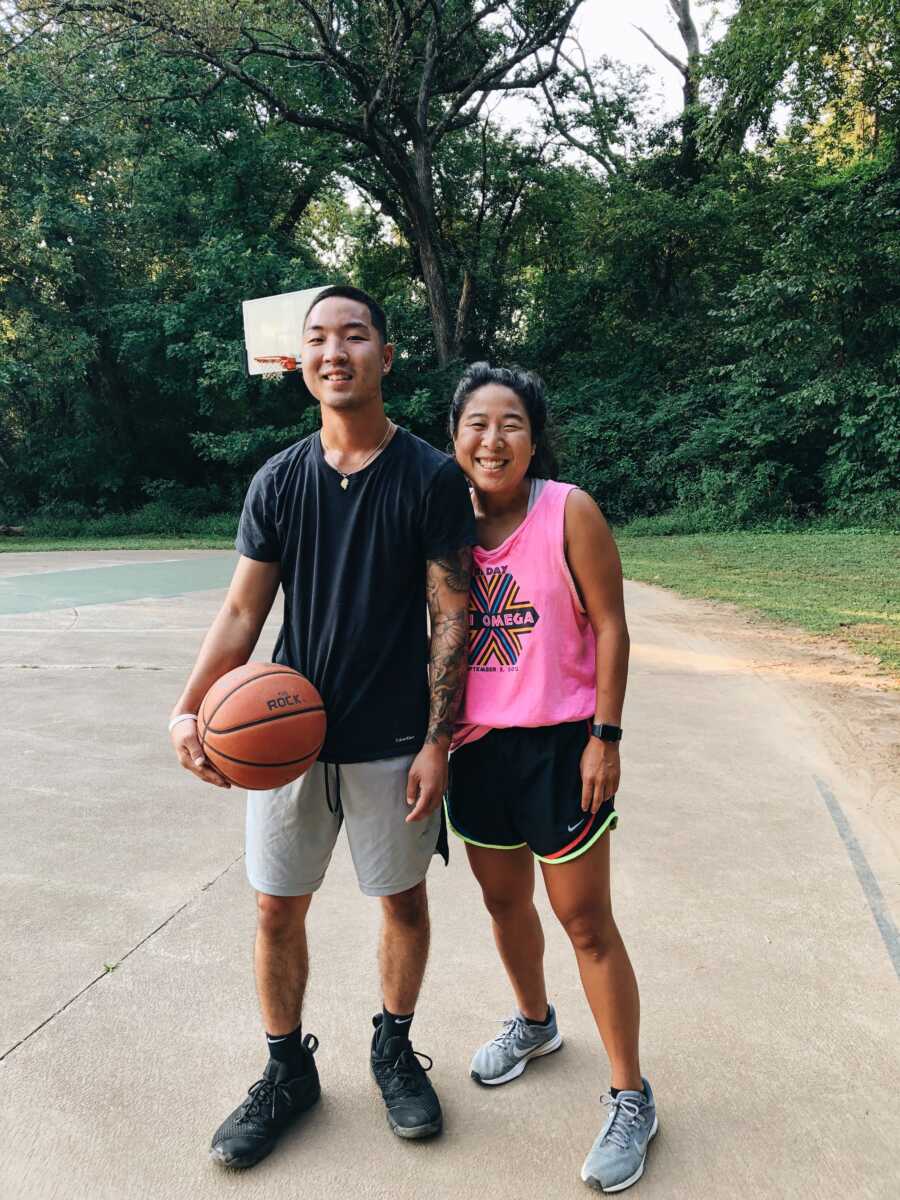 korean adoptees standing on basketball court