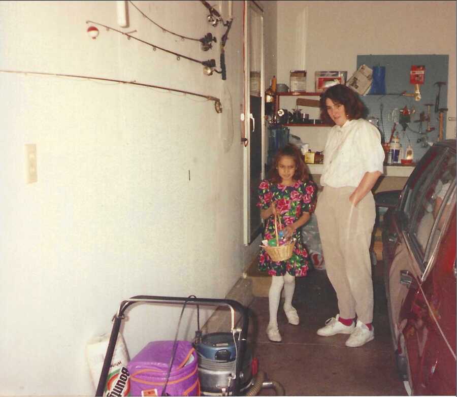 mom with daughter in garage on easter, daughter holds basket