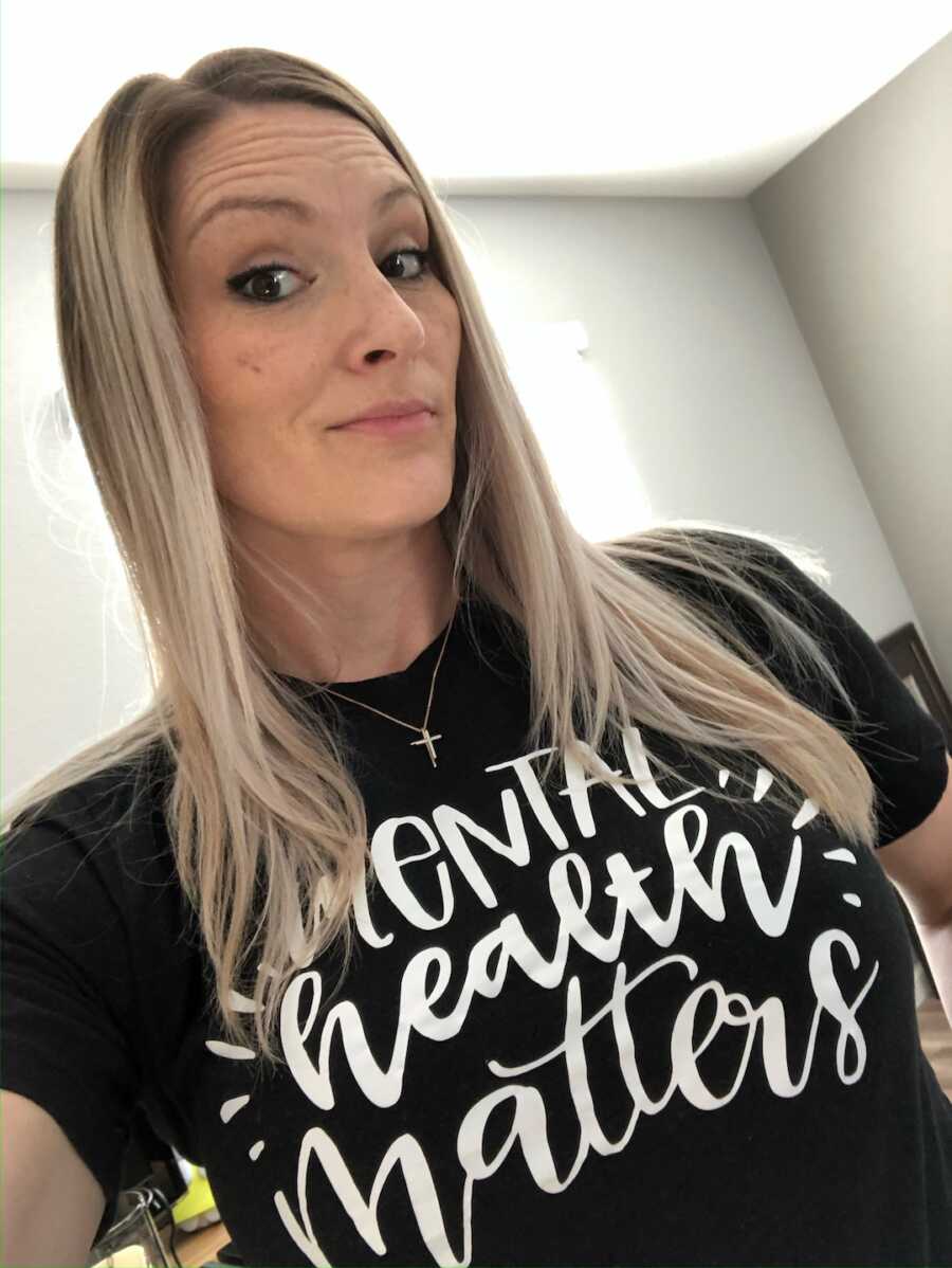 woman recovered from alcohol addiction wearing "mental health matters" shirt