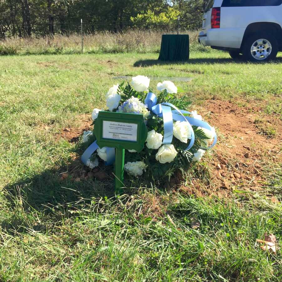 Flowers placed on the grave of boy who died after birth