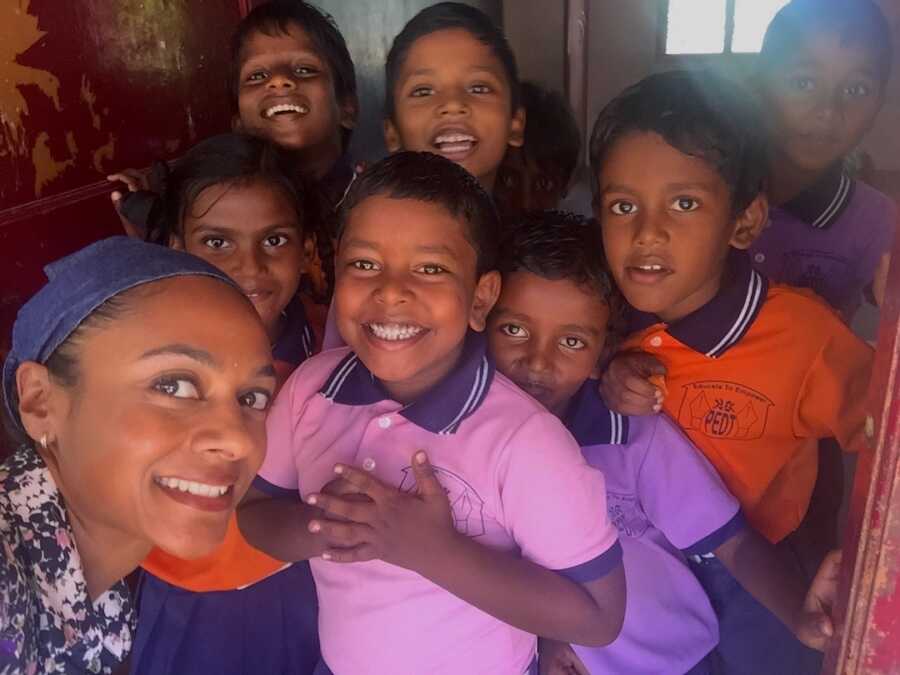 woman volunteering with children at an orphanage in India