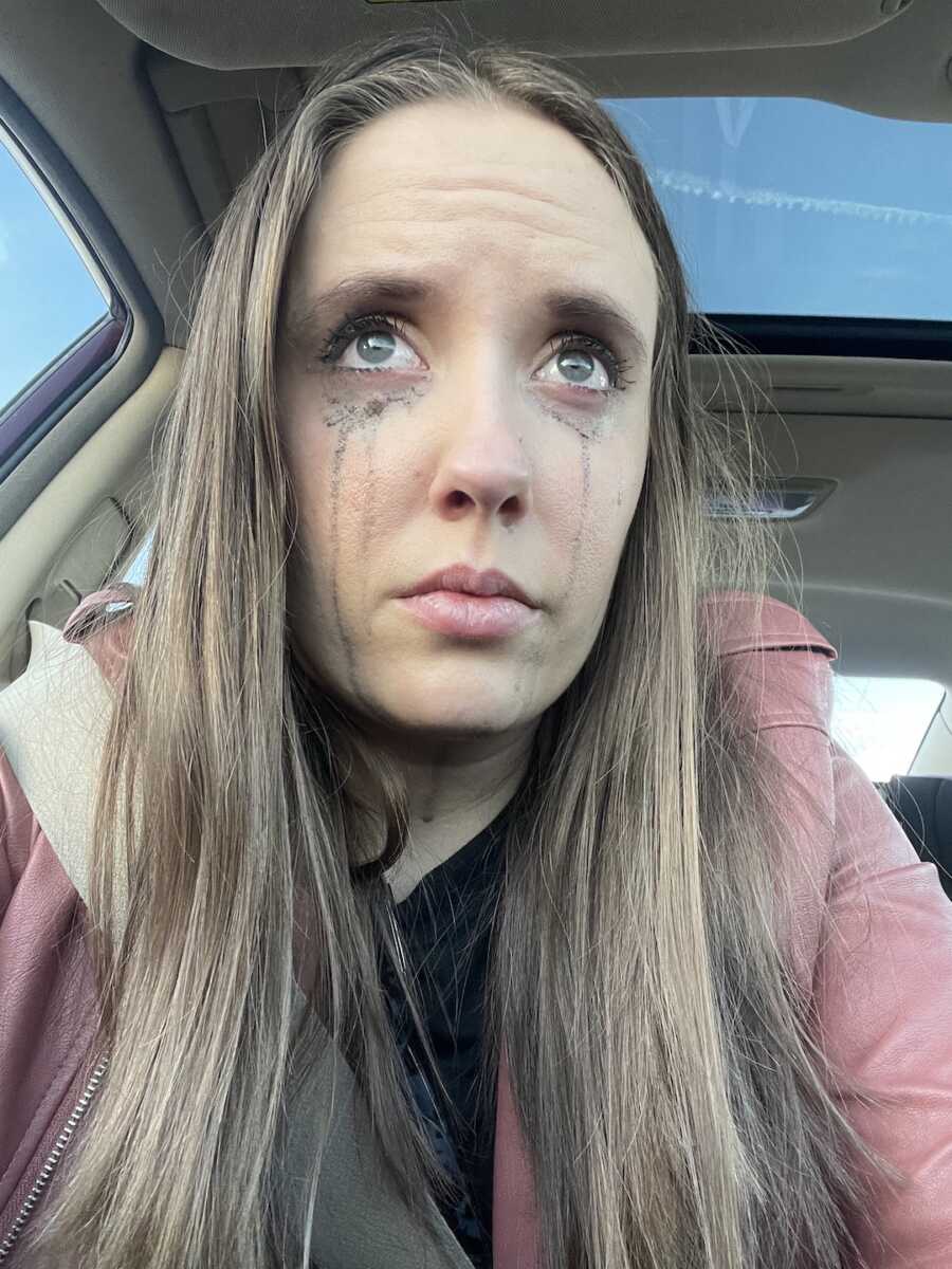 woman with lyme disease has makeup running down face from crying
