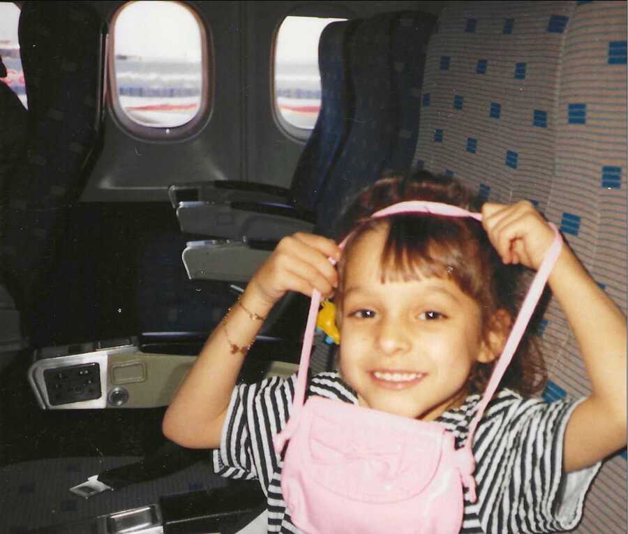 girl with asthma sitting on plane to Puerto Rico