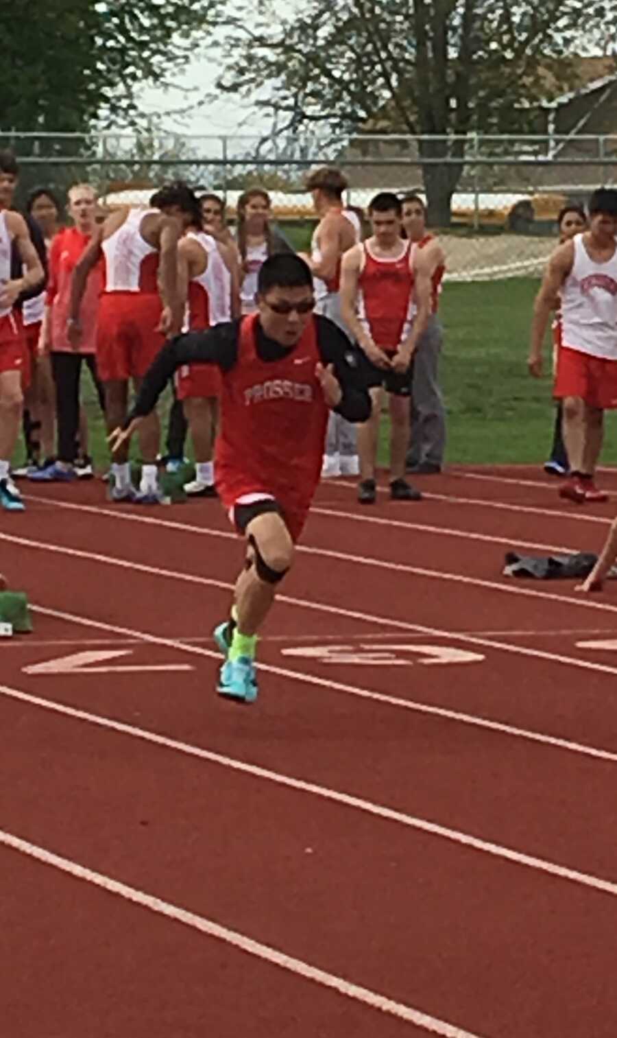 FASD survivor running track in track uniform