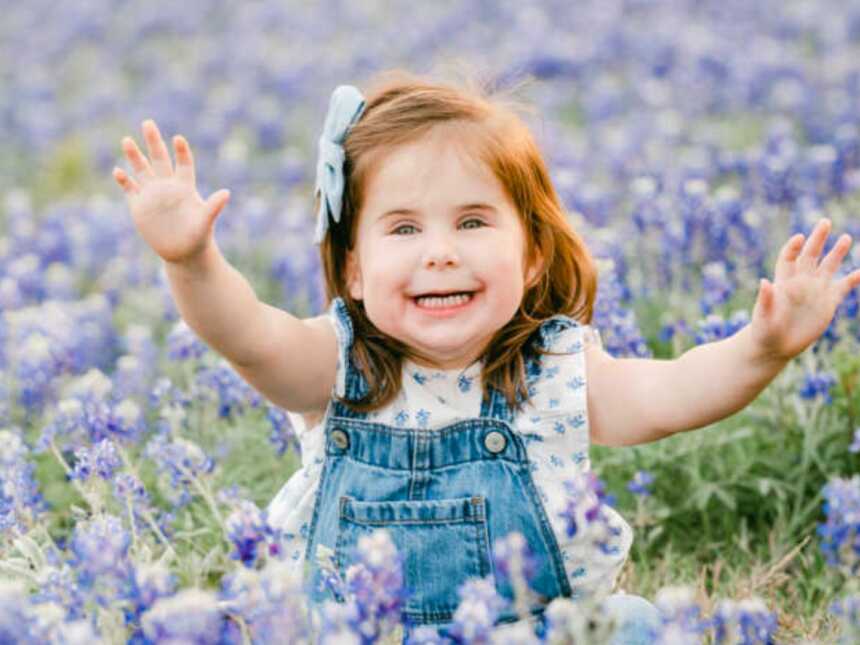 Girl with rare genetic disorder sitting in lavender field